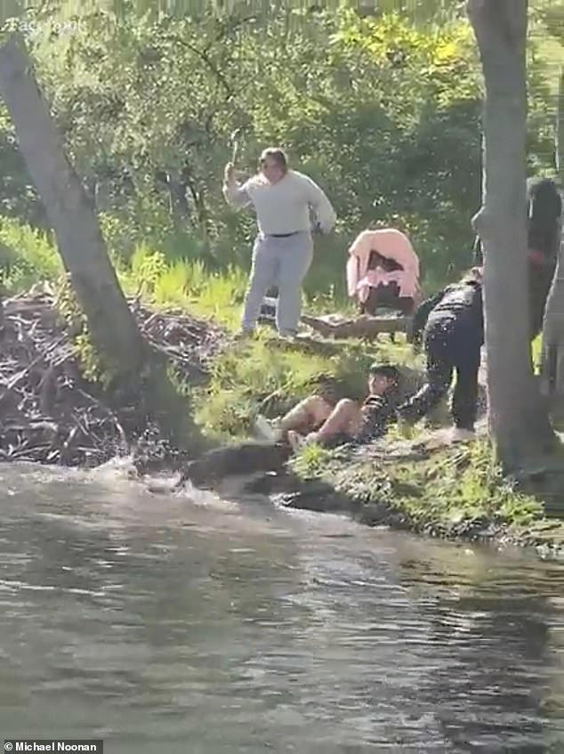 Moment boy, 8, is attacked by rabid beaver while fishing in river