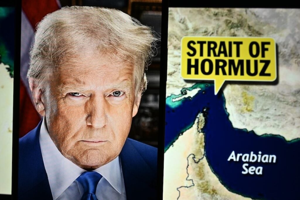 U.s.,President,Donald,Trump,Appears,On,Screen,,With,The,Strait