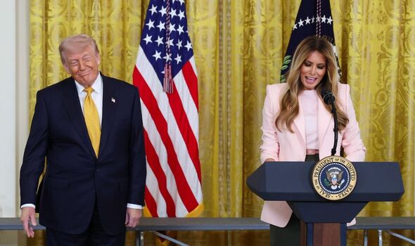 Melania Trump embraces Donald for rare kiss in public at Mother's Day event