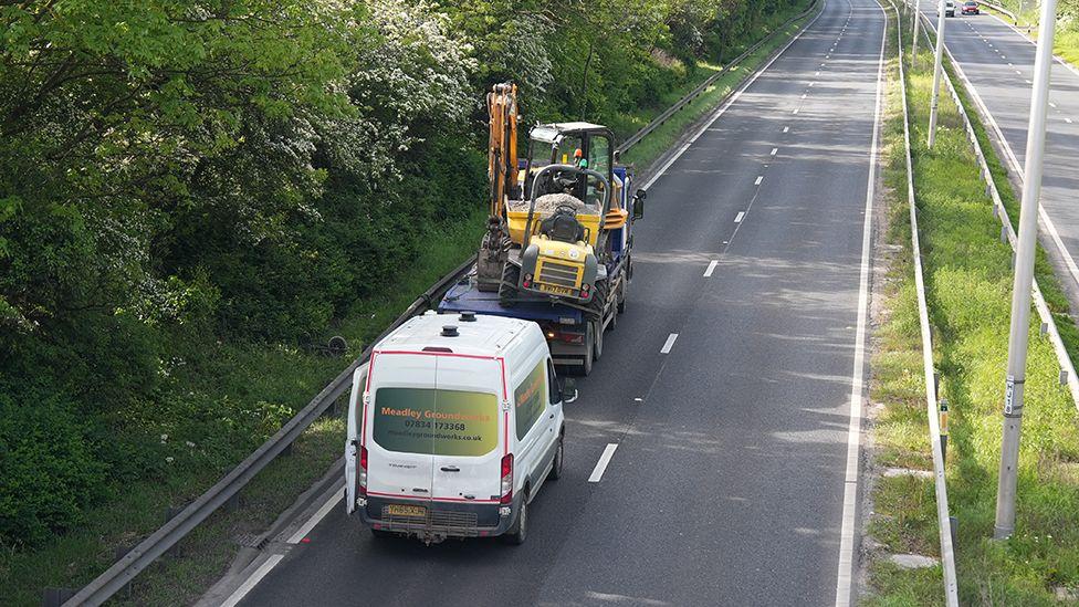 Major road closed after lorry hits two bridges