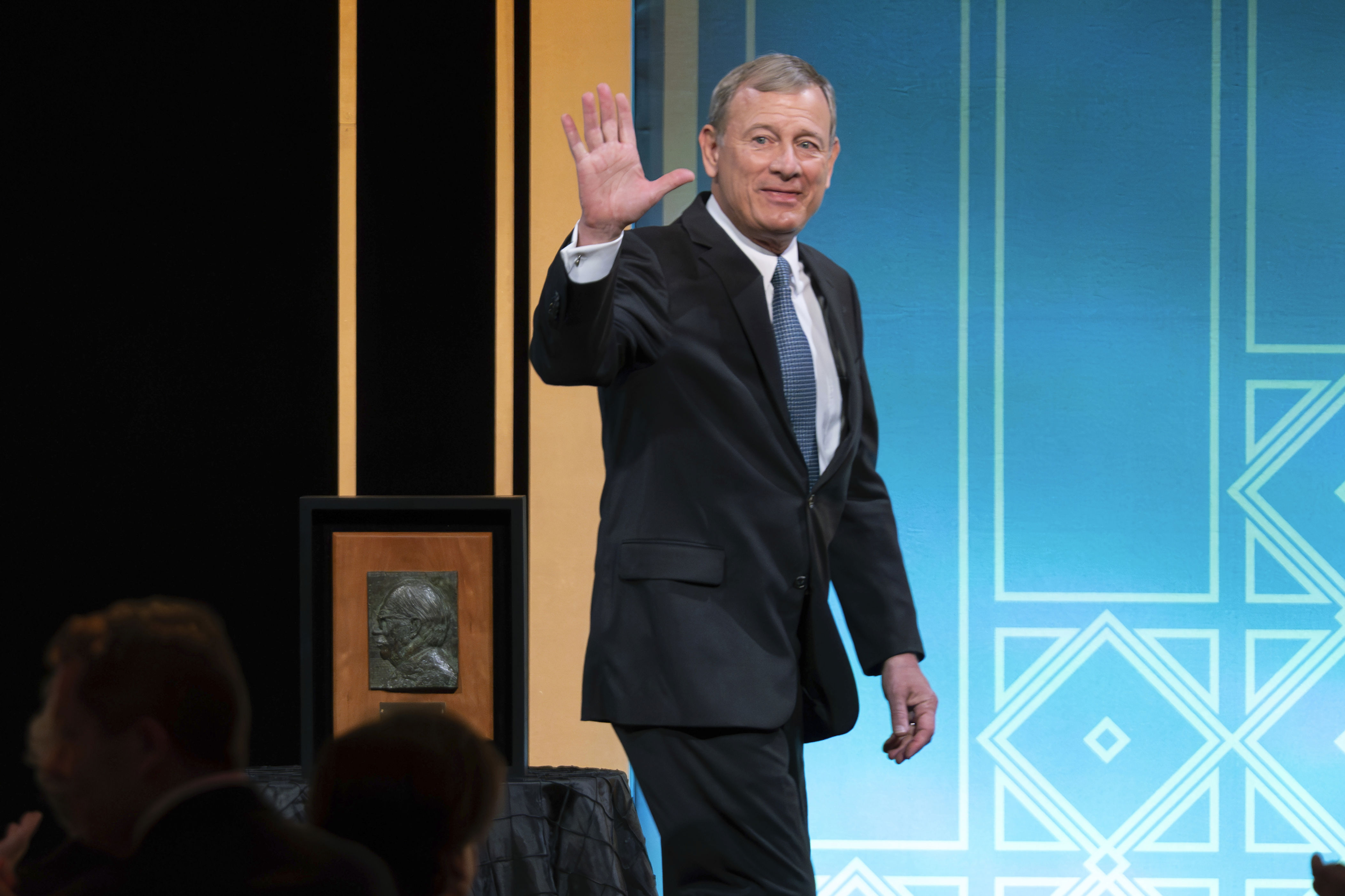 Supreme Court Chief Justice John Roberts waves after he received the Henry J. Friendly Medal during the American Law Institute’s annual dinner​ in Washington on May 23, 2023.
