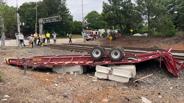 Road reopens after Amtrak train collides with trailer in Cary; six ...