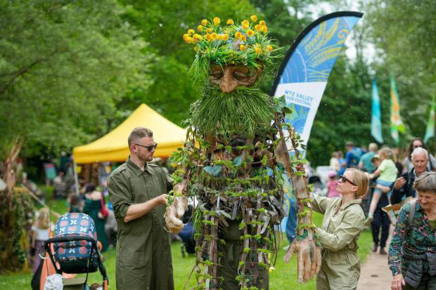 Thousands flock to festival of colour, music and puppets