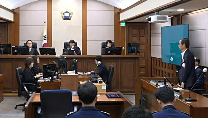 Ex-PM Han’s insurrection sentence cut to 15 years