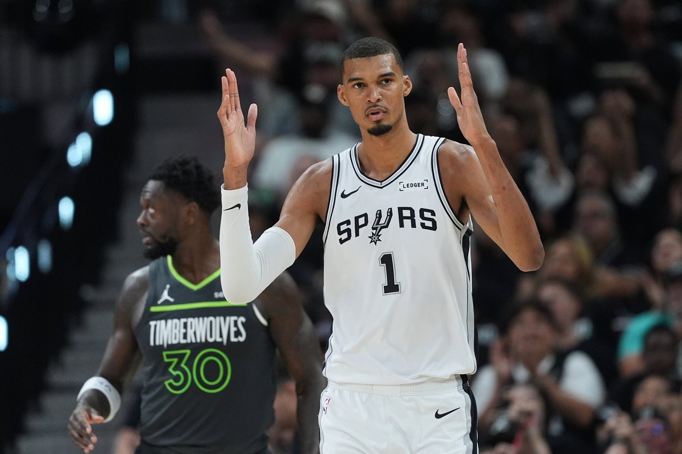 San Antonio Spurs forward Victor Wembanyama (1) reacts to a play during the first half in Game 2 of a second-round NBA playoffs basketball series against the Minnesota Timberwolves in San Antonio, Wednesday, May 6, 2026. (AP Photo/Eric Gay)