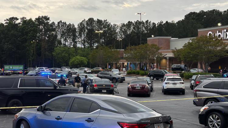 Woman killed, man charged with murder in shooting in parking lot of ...