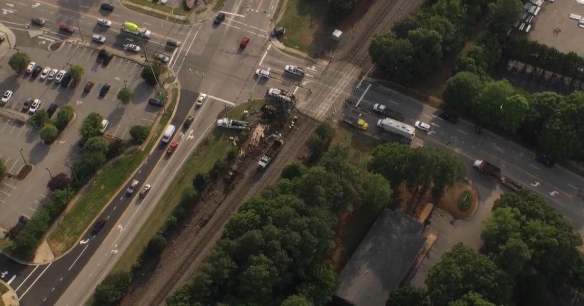 Road reopens after Amtrak train collides with trailer in Cary; six ...