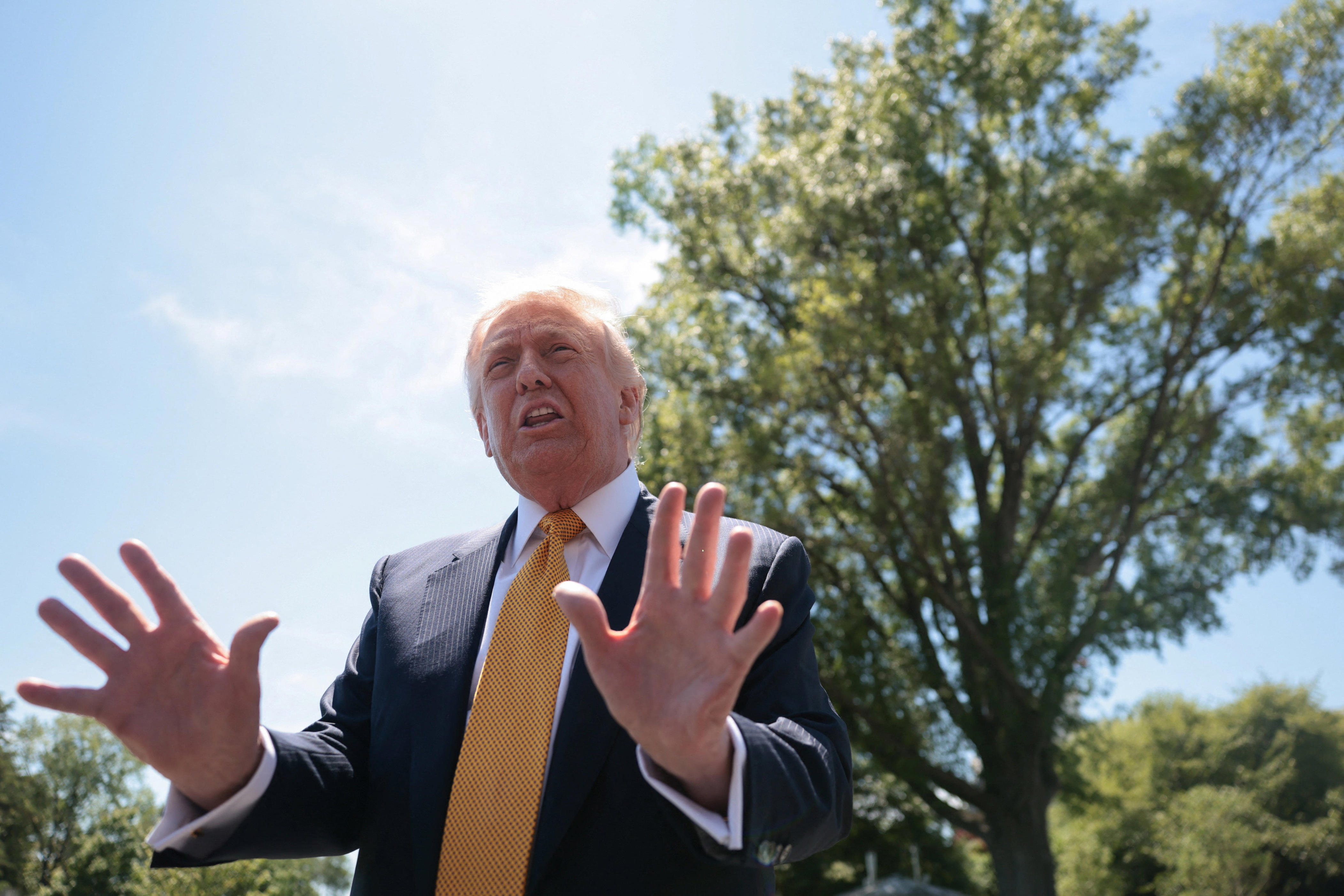President Donald Trump speaks to the press, ahead of departing the White House for Joint Base Andrews en route to Beijing, China, in Washington, D.C., U.S., May 12, 2026.