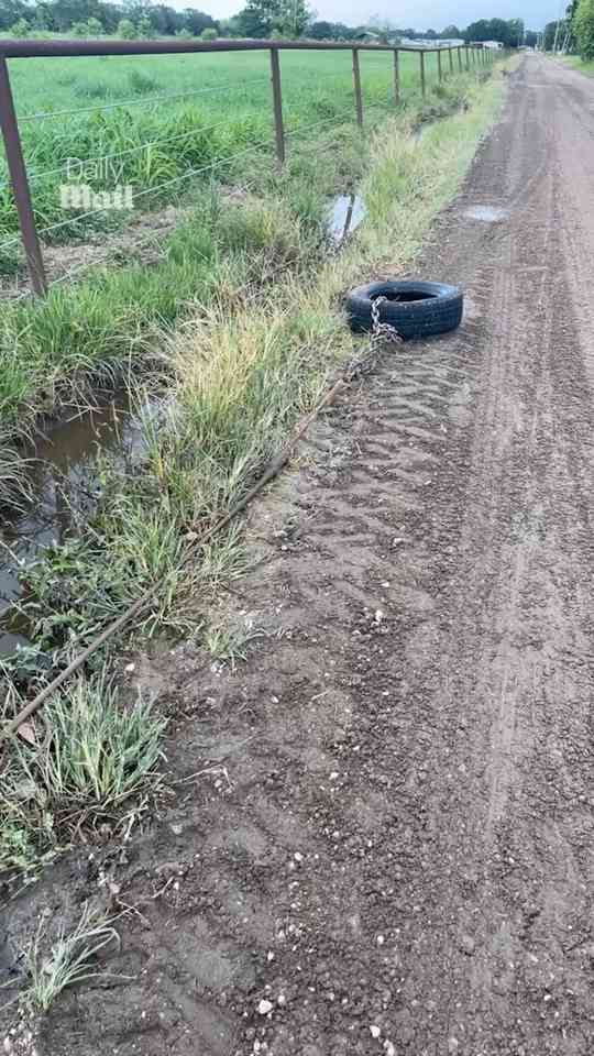 Man uses old tire to clear clogged culvert in genius DIY fix
