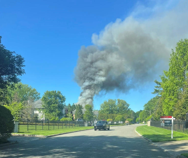 Firefighters battle large house fire in Norwood