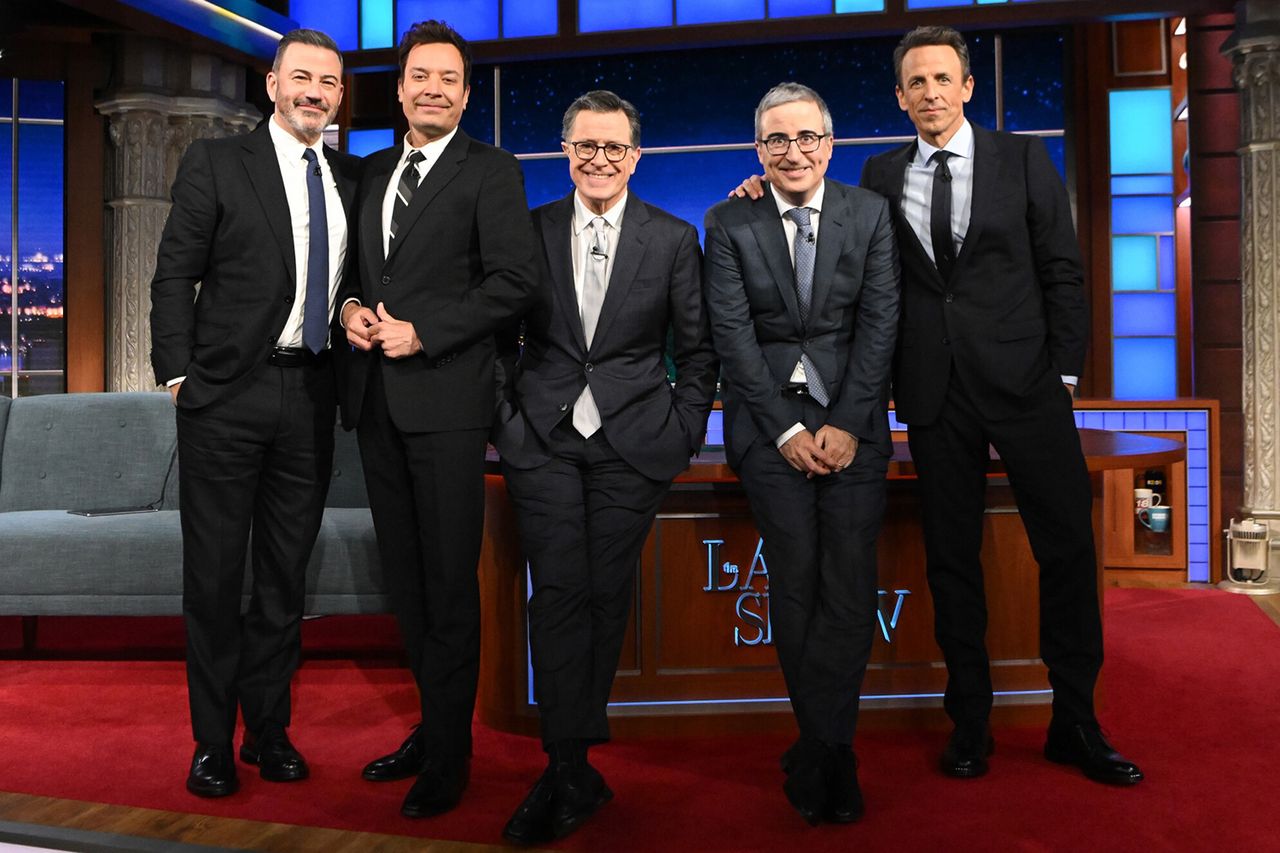 Stephen Colbert and Jimmy Fallon share a smooch as late-night hosts ...