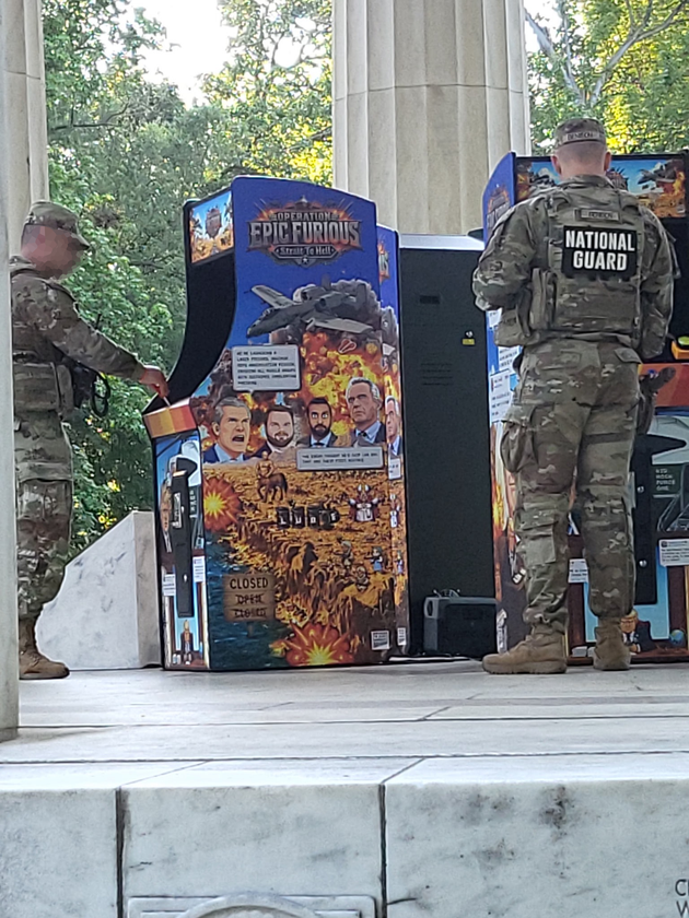 Photo shows soldiers playing Trump arcade game at DC war memorial