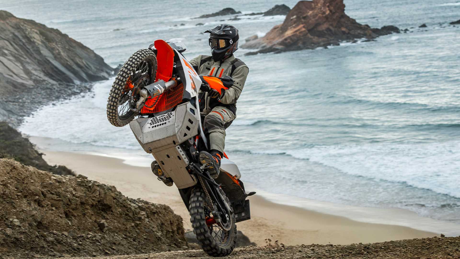 Rider doing a wheelie off road on the KTM 890 Adventure R