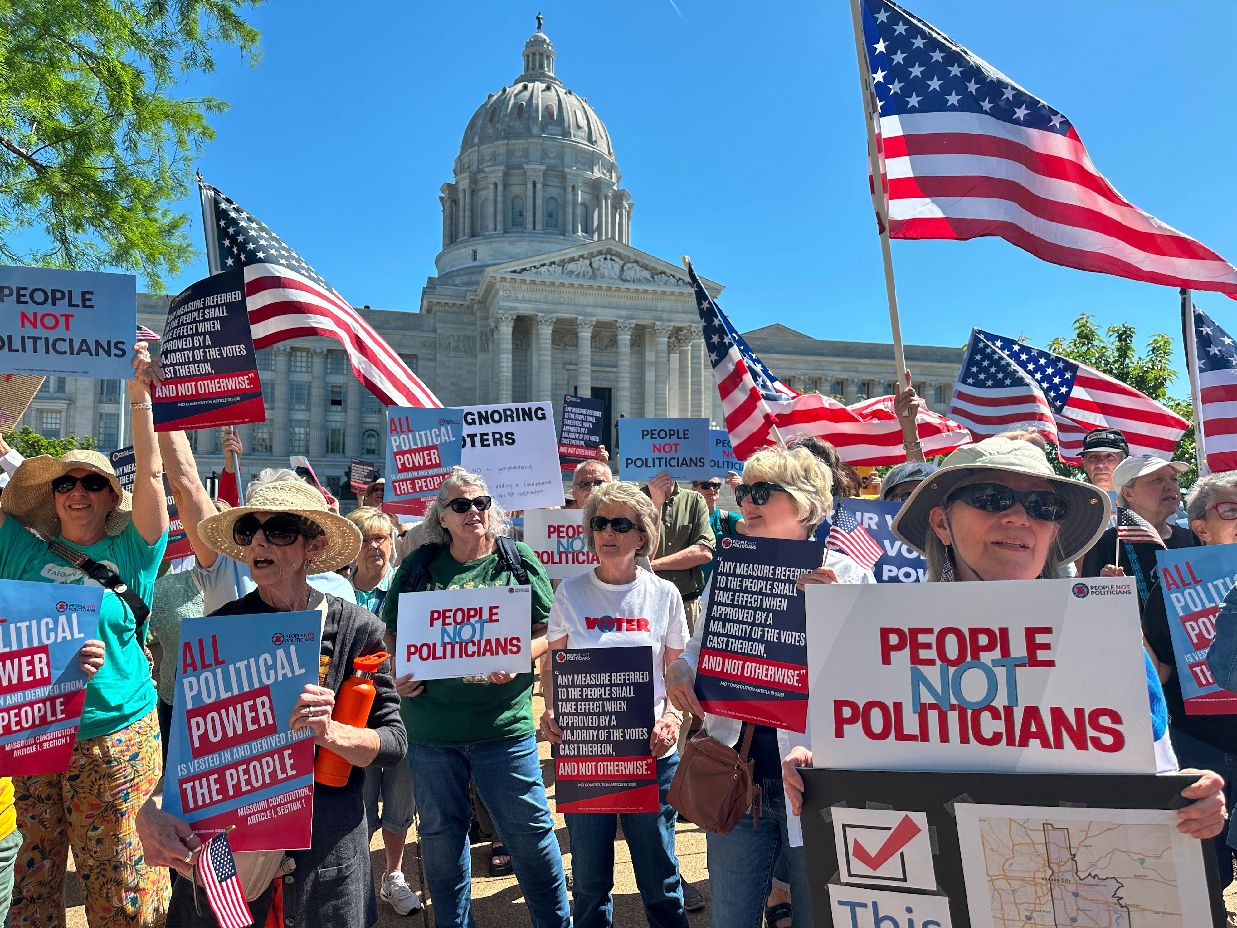 Protesters against a Missouri congressional redistricting plan gather outside the Missouri Capitol on May 12, 2026, in Jefferson City, Missouri.