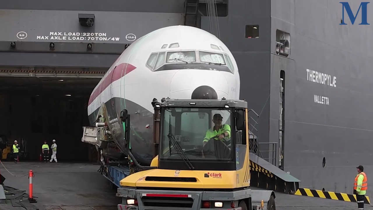 John Travolta’s former Qantas Boeing 707 arrives at Port Kembla harbour