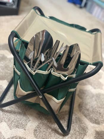 The tools stored in caddy on folding seat