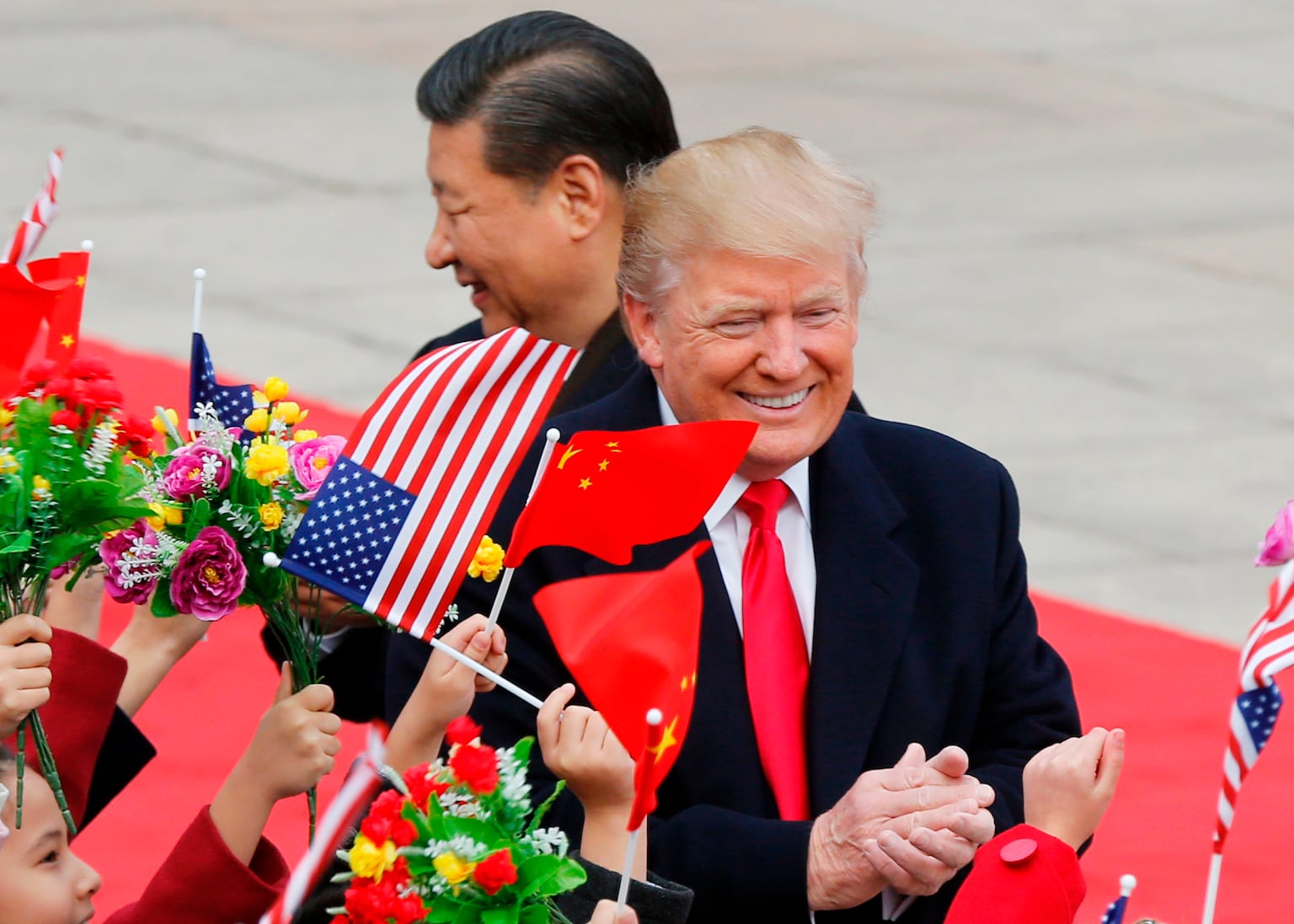 Trump arrives in China for summit as war and inflation weigh on presidency