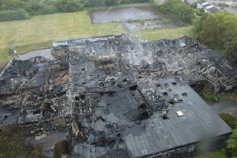 Police and firefighters remain at scene of huge derelict school fire