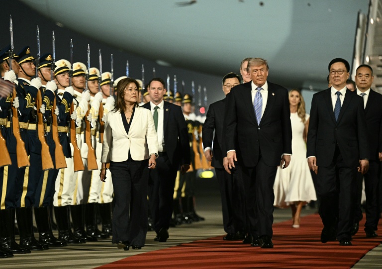 Trump arrives in China for superpower summit with Xi