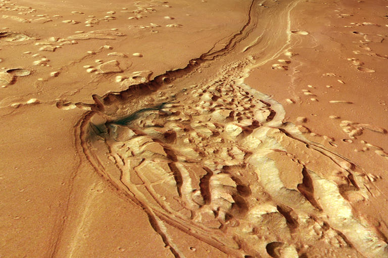Strange, dark material spotted in an ancient channel on Mars, where ...