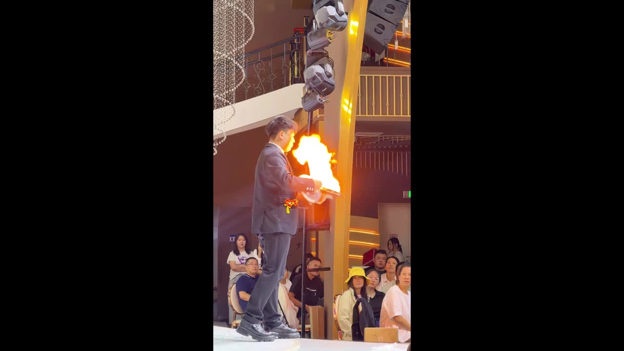 Magician accidentally sets fire to his own hair, crowd forced to warn ...