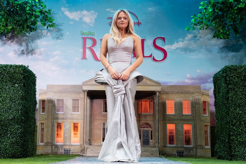 Emily Atack leads glamorous arrivals in plunging dress at Rivals premiere