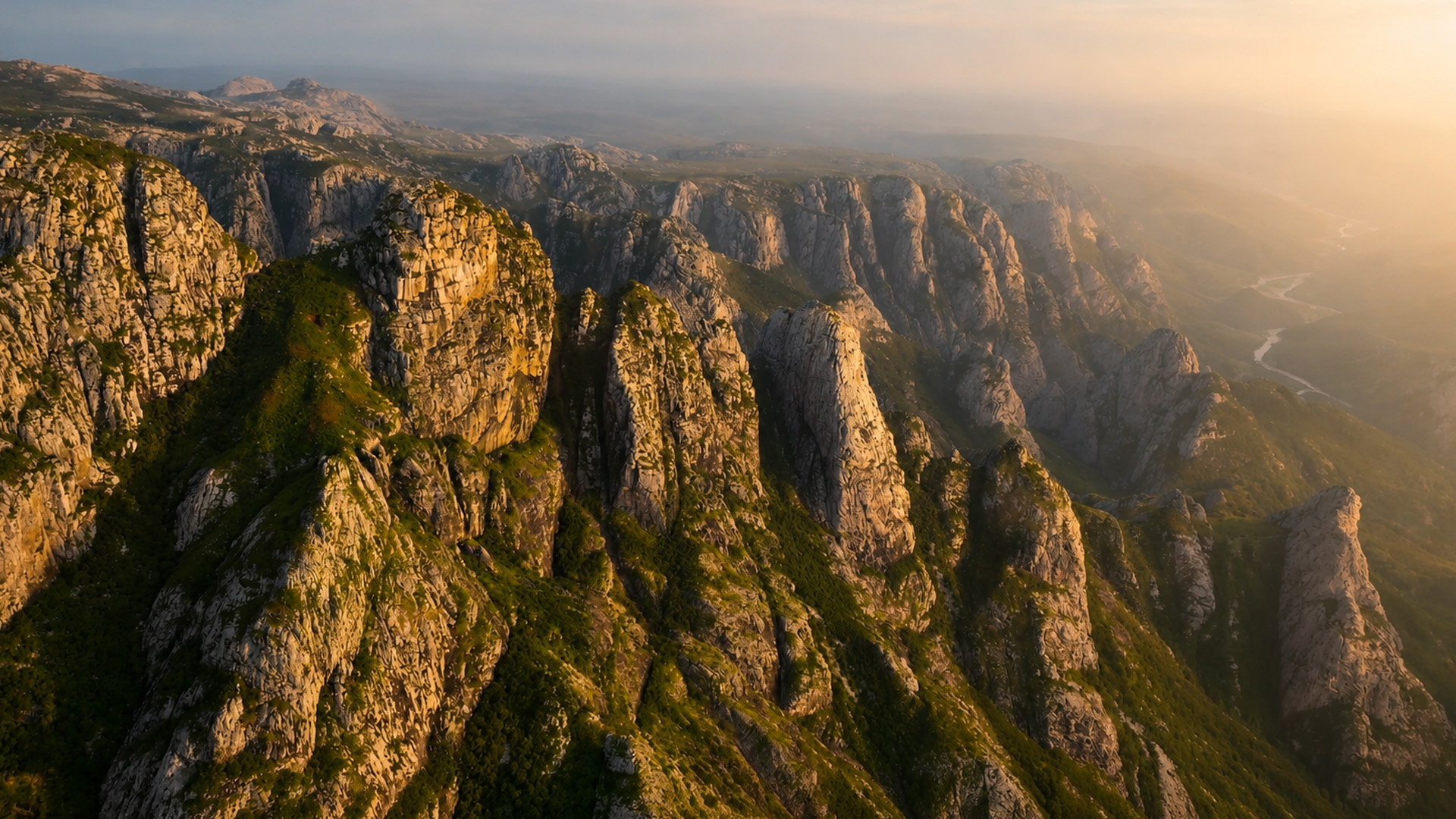 Steep desert mountains covered in narrow ravines