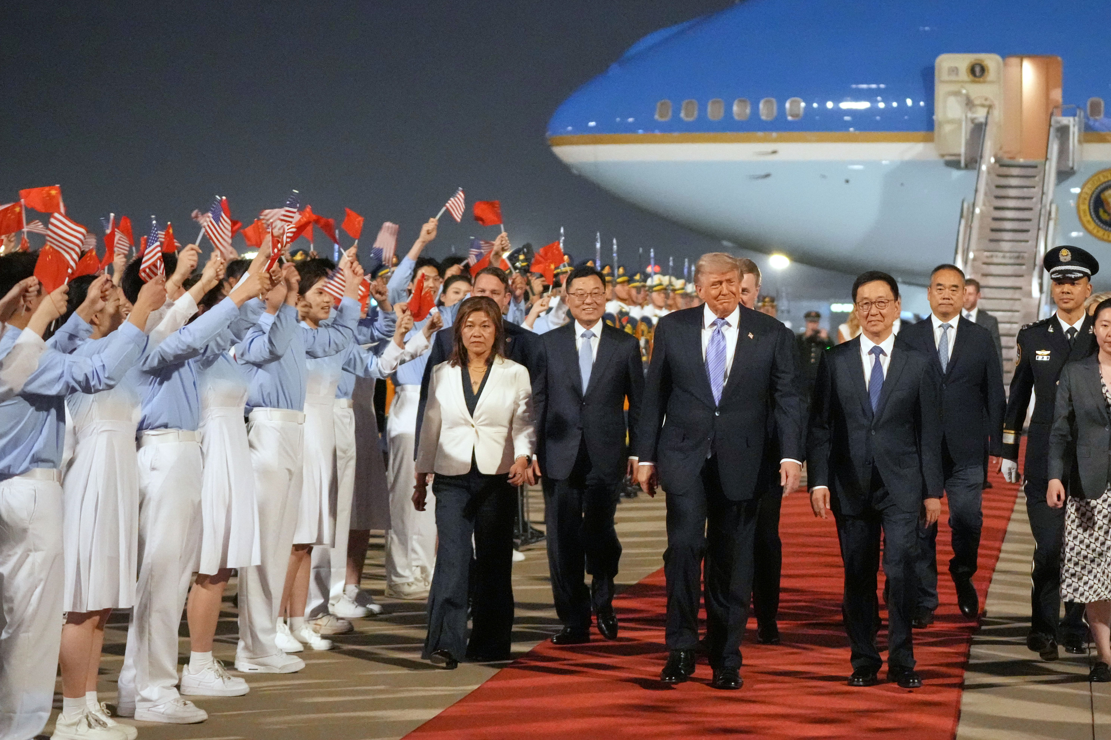 President Donald Trump walks with China's Vice President Han Zheng during a welcome ceremony on May 13, 2026, at Beijing Capital International Airport.
