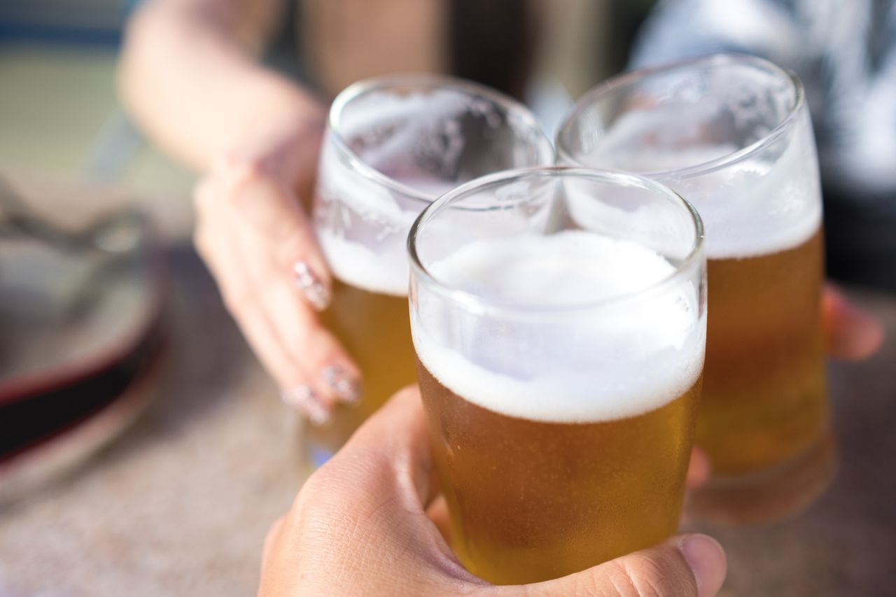 clinking glasses of beer