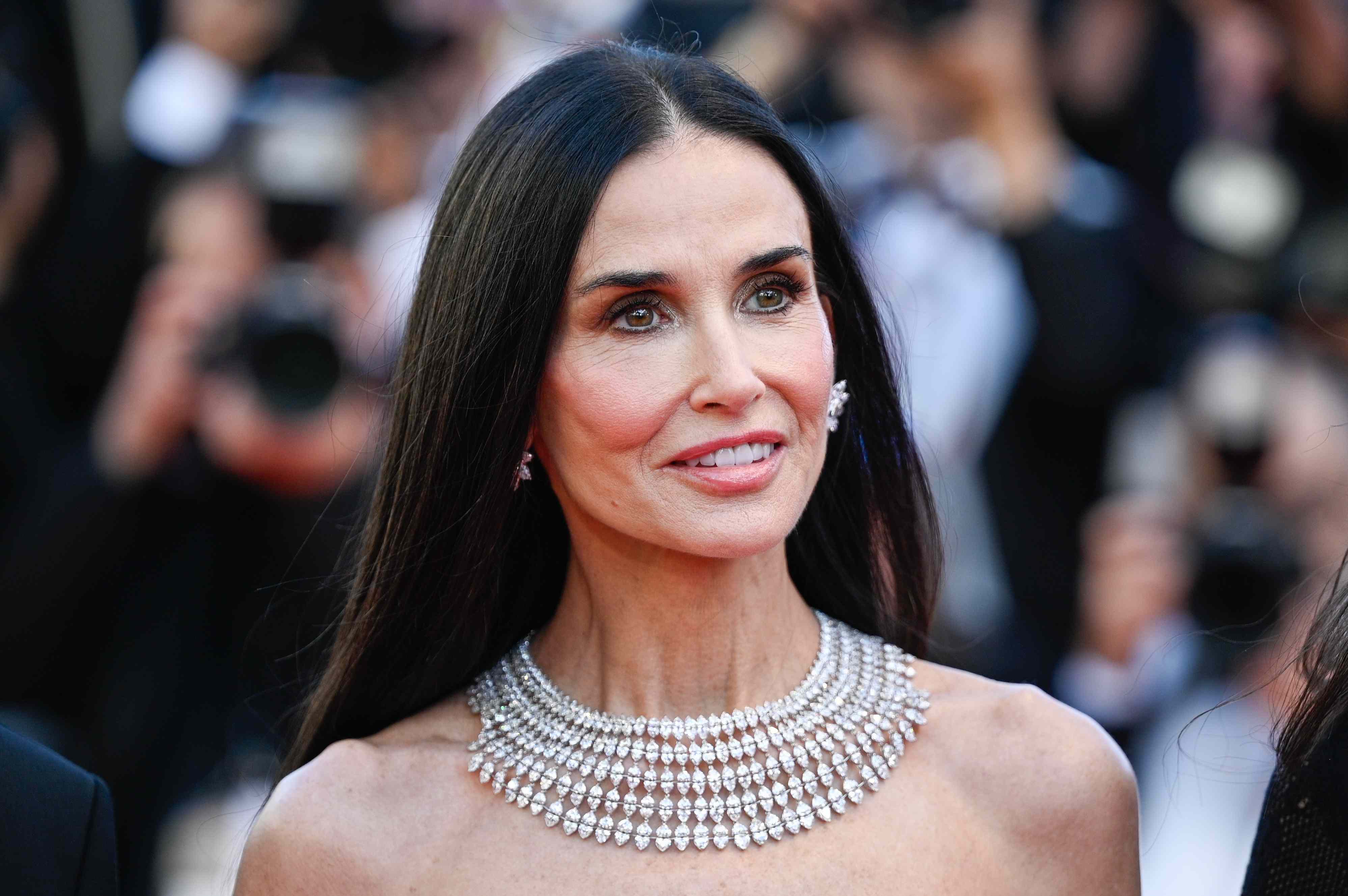 Demi Moore's semi-sheer thigh-slit gown looks like liquid, matching her ...