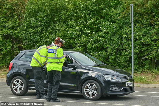 Police officers conducting tests with the new breathalyser