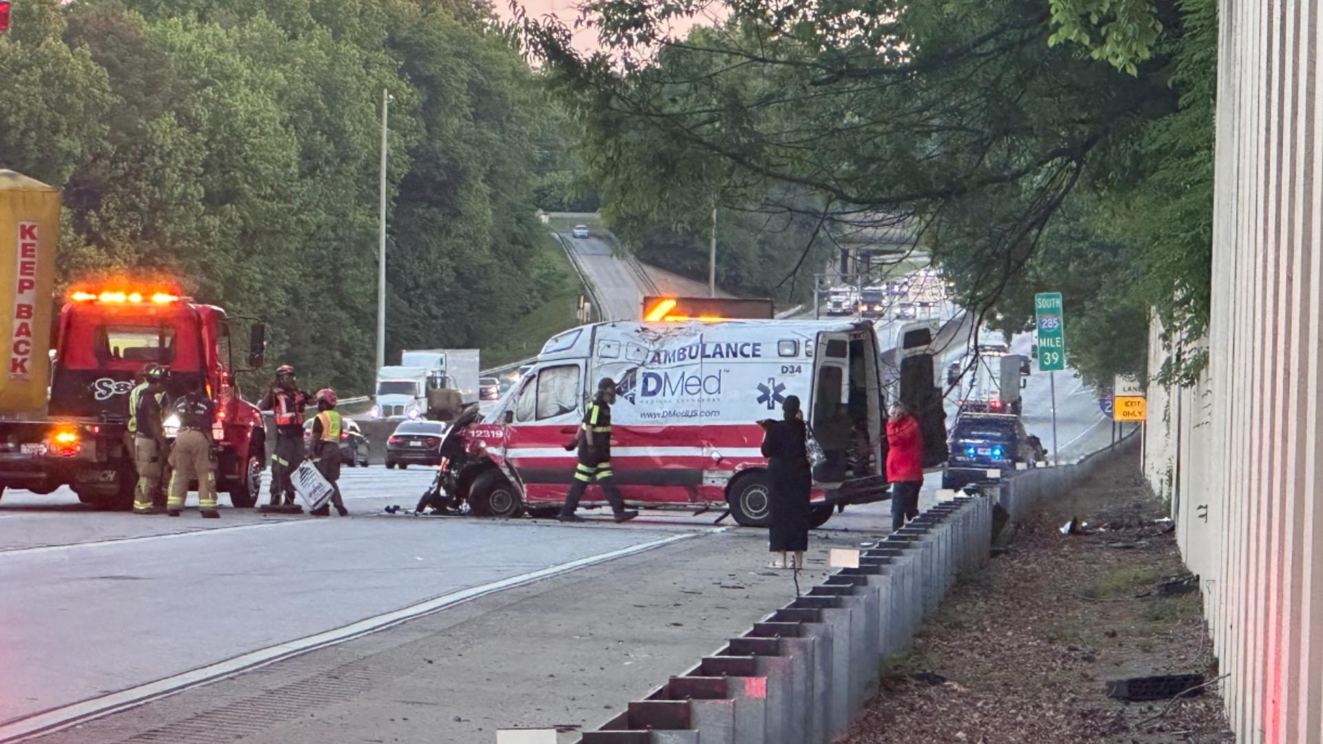 Ambulance flips over with patient inside on I-285