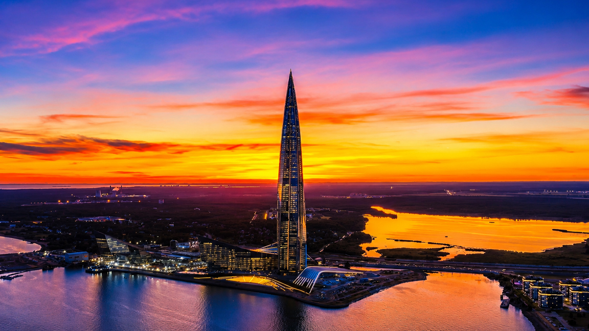 Skyscraper standing alone beneath a colorful horizon
