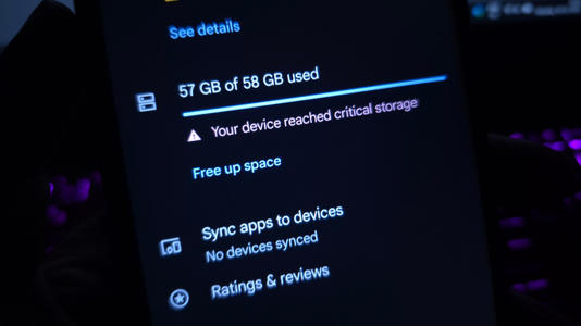 A smartphone showing a critical storage warning