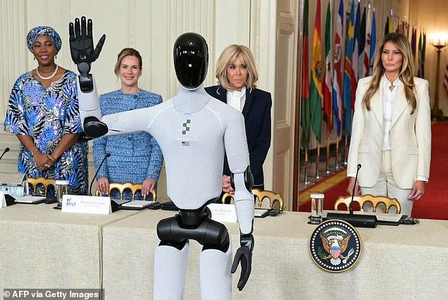 Ms Jabbe Boi is pictured with Polish first lady Marta Nawrocka, French first lady Brigitte Macron and US first lady Melania Trump (left to right) at a Summit, featuring a robot, in Washington this year 