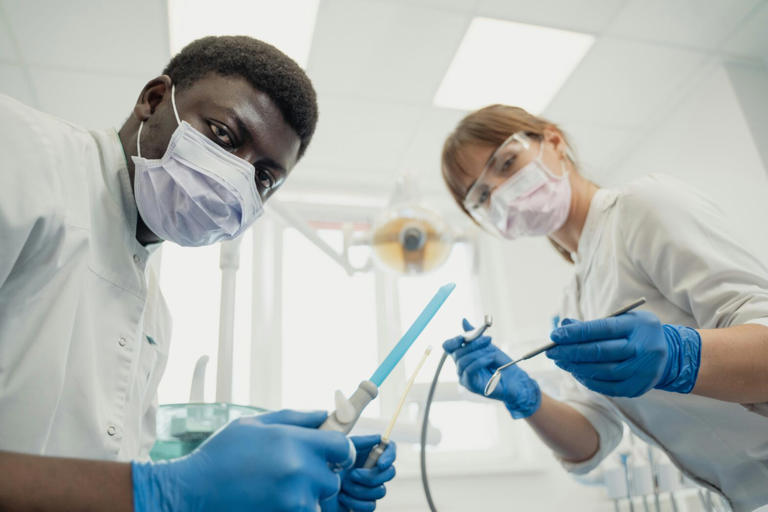 Is there actually a link between root canals and cancer? Dental experts ...