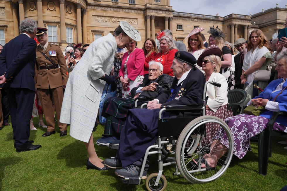 Princess Anne told to 'slow down' by veteran, 100, at Buckingham Palace ...