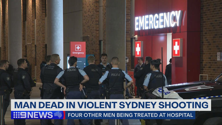 Police mill outside an emergency department after an alleged shooting in a Canley Heights home.