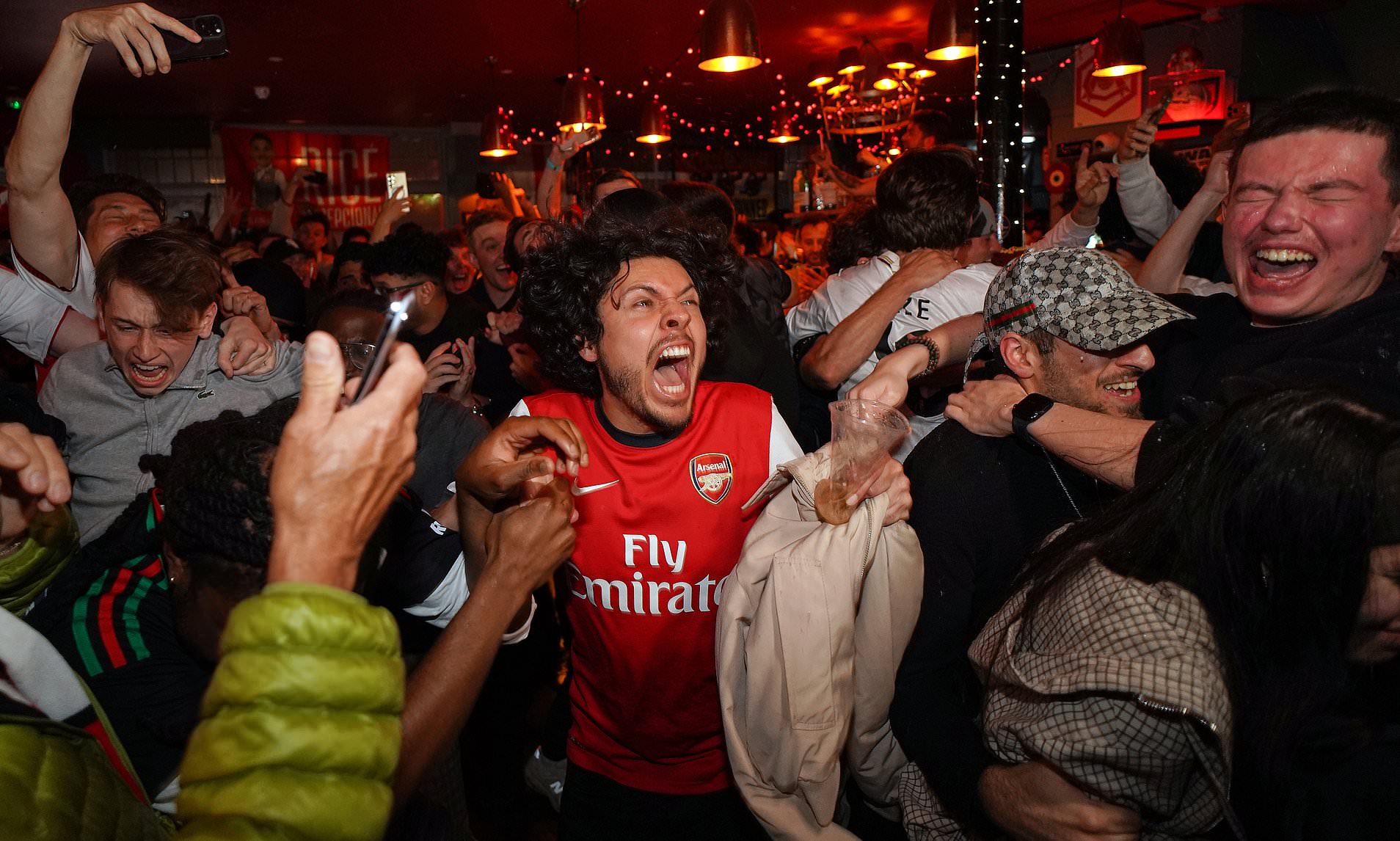 Arsenal fans paint North London red as they celebrate first Premier ...