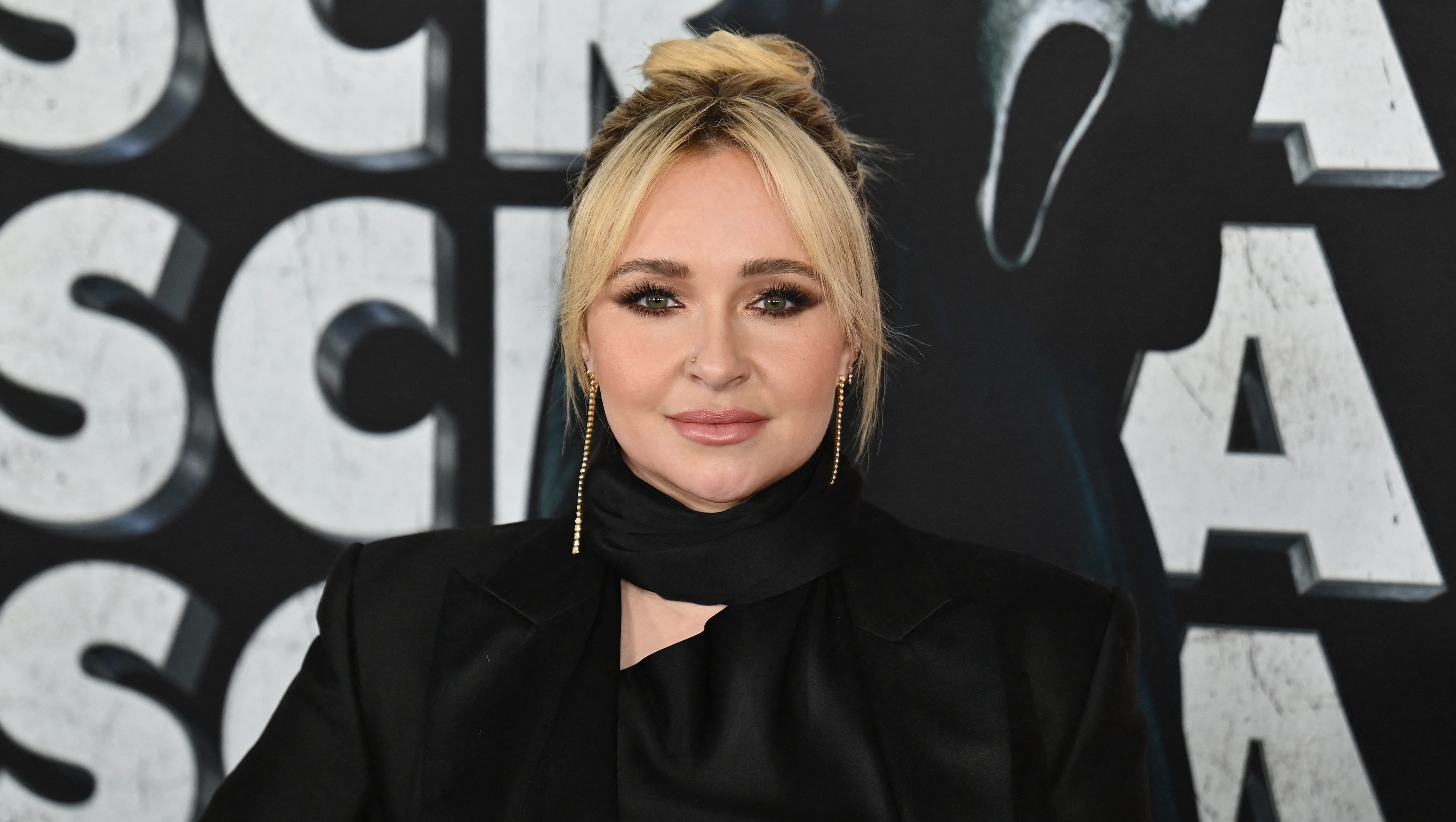 Who is the British singer Hayden Panettiere is talking about in her book?