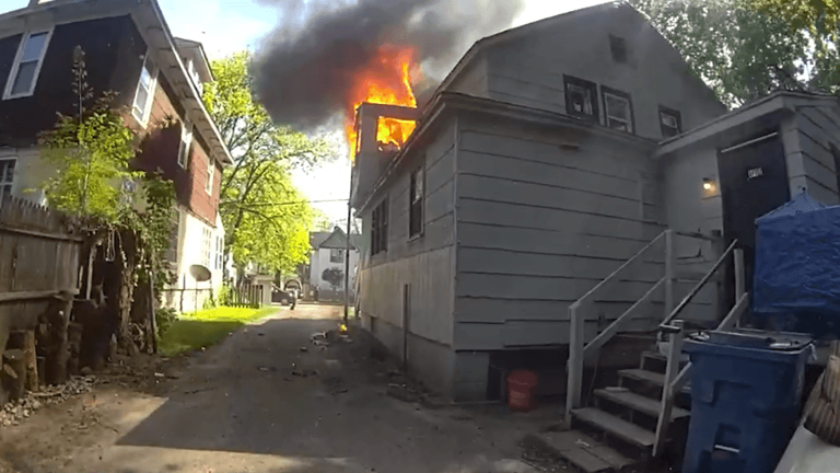 Video shows moment officer catches baby tossed from burning Kalamazoo home