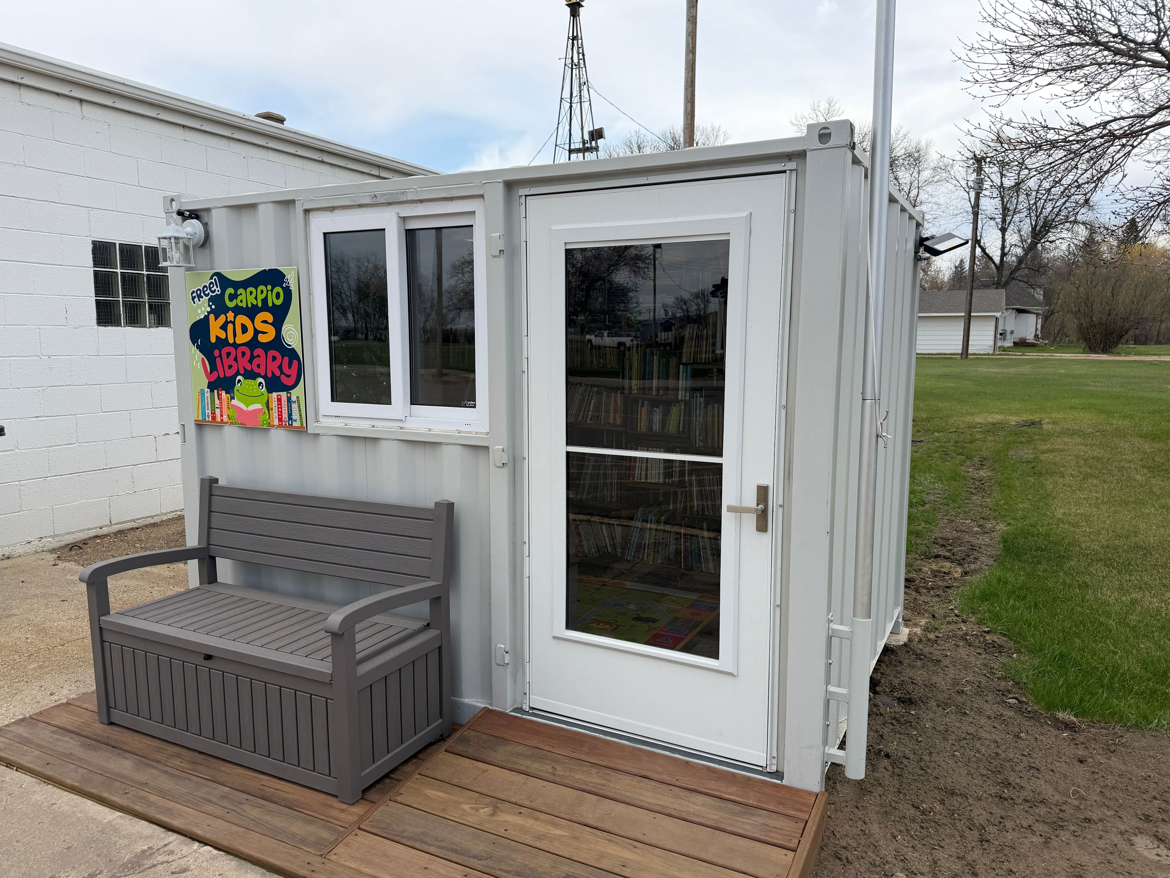 Carpio couple transformation shipping container into little free library