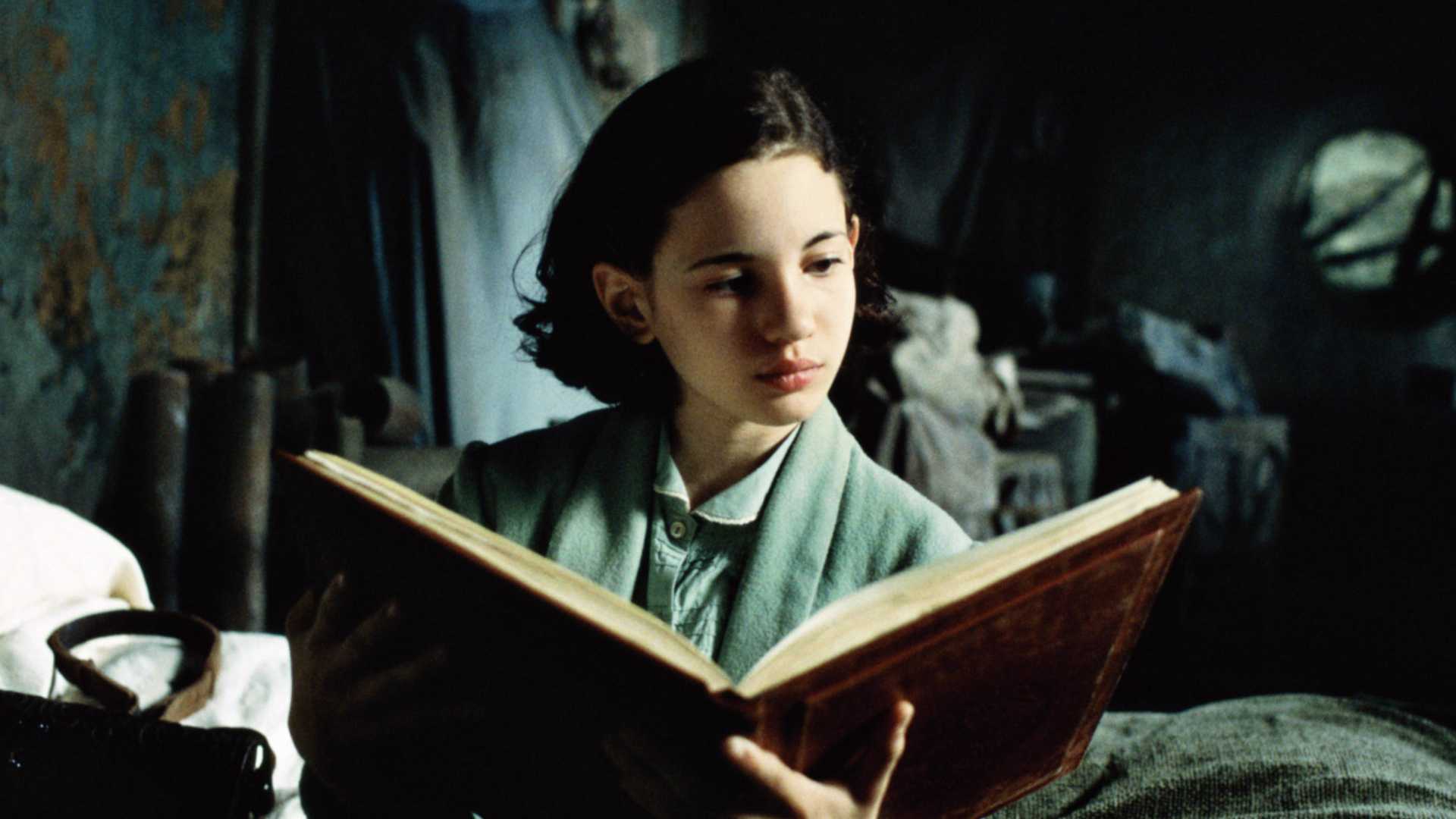 Ivana Baquero opens a book in Pan's Labyrinth