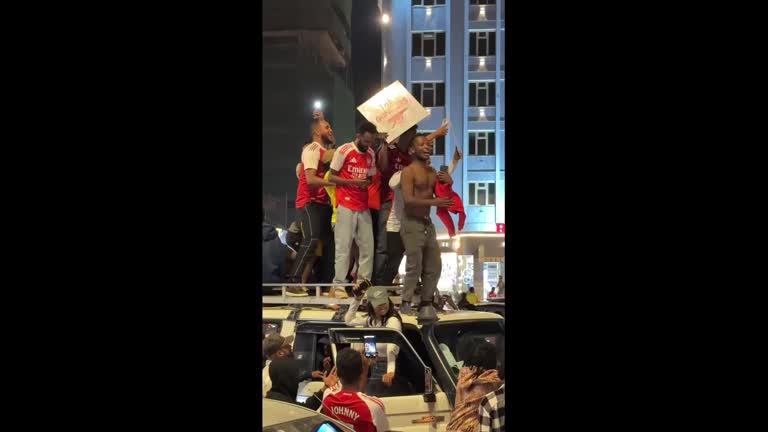 Soccer fans in Addis Ababa celebrate Arsenal Premiere League win