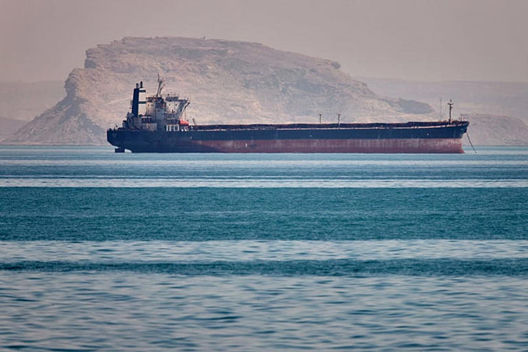 A bulk cargo ship sits at anchor in the Strait of Hormuz off Bandar Abbas, Iran, Saturday, May 2, 2026. ISNA via AP/Amirhosein Khorgooi