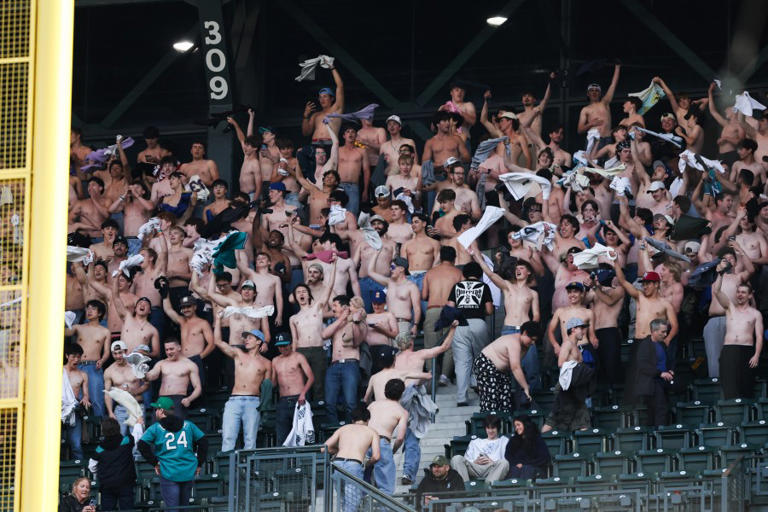 Shirtless fans become 'Tarps Off' stars at baseball stadiums