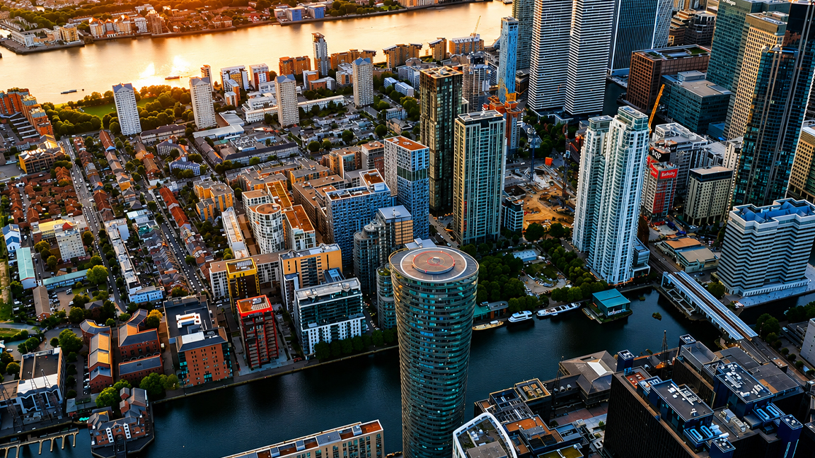 Contemporary urban panorama with river and towers