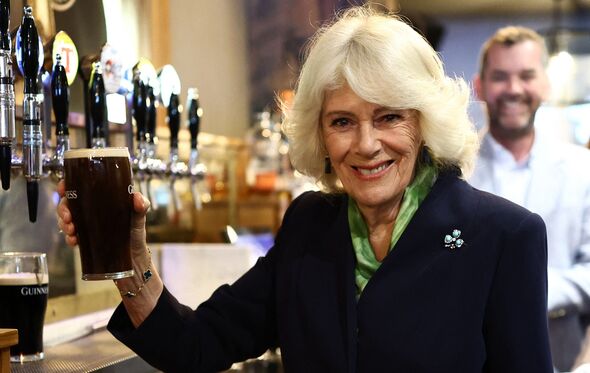Queen Camilla nervously pours pint of Guinness during Northern Ireland trip