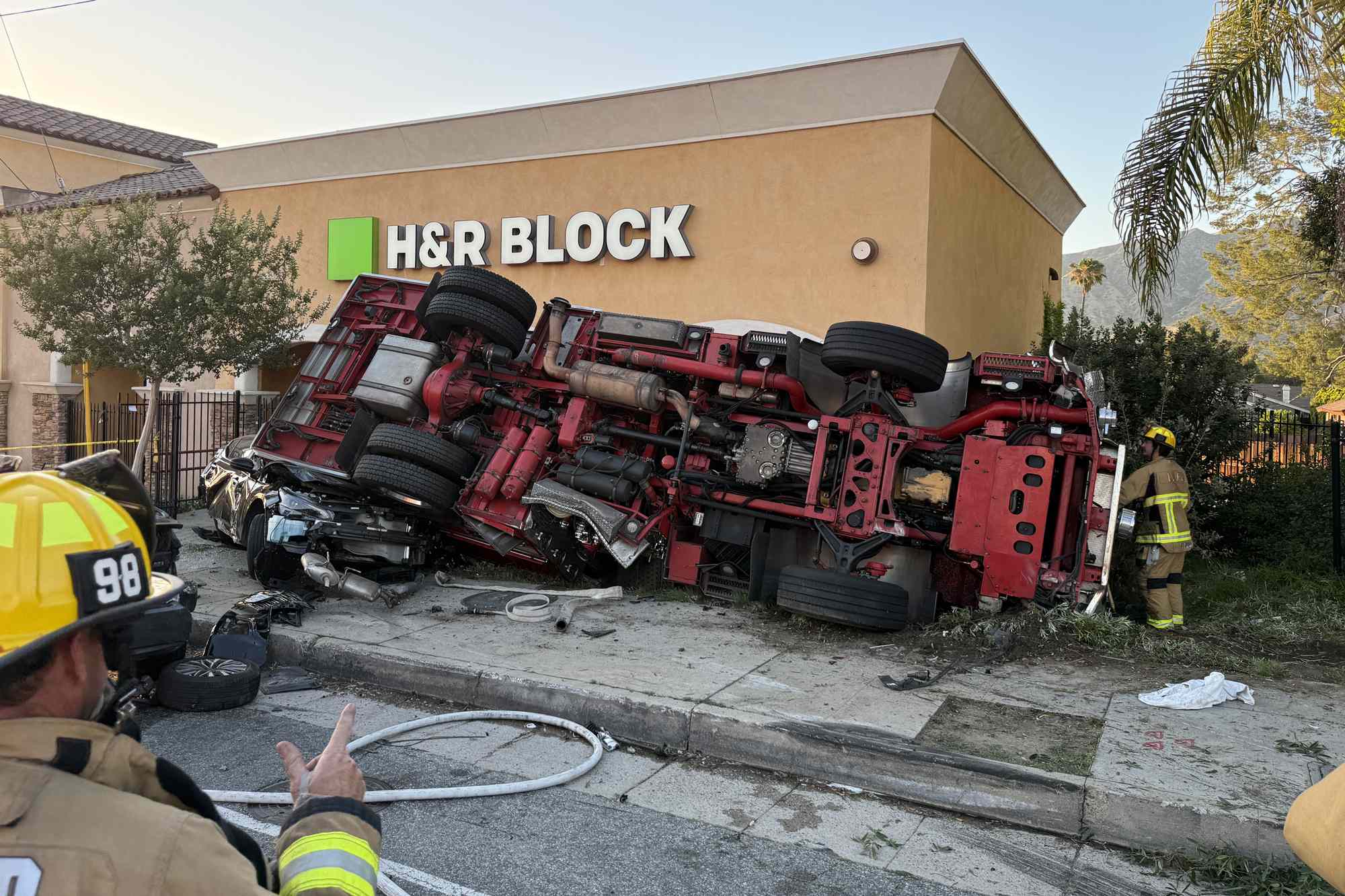 2 firefighters injured after firetruck loses control on way to ...