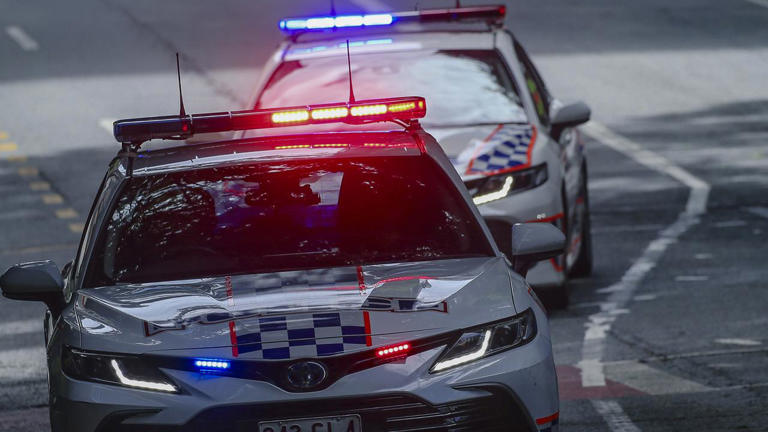 Woman hit by cop car, rushed to hospital